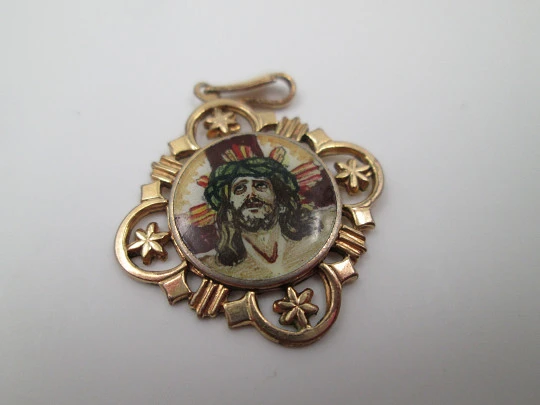 Openwork golden metal medal. Painted scene Jesus crucified. 1940's
