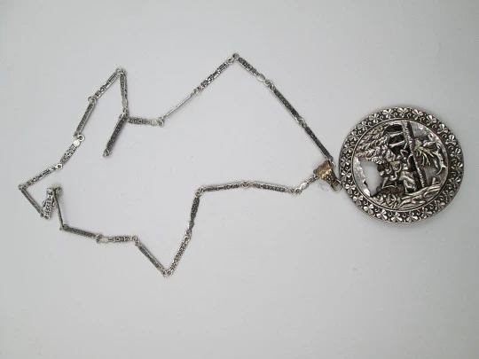 Openwork pendant with chain. Silver. 1970's. Horse riders scene