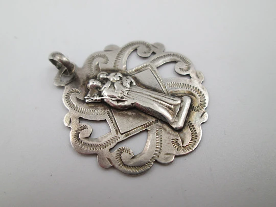 Openwork religious medal. Saint Joseph with the Child. Sterling silver. Europe. 1940's