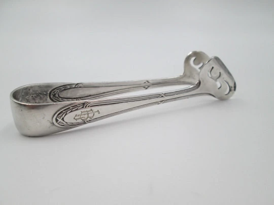 Openwork sugar tongs. Silver plated metal. Ribbed design and wheat ears. 1950's