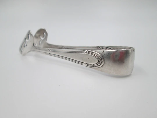 Openwork sugar tongs. Silver plated metal. Ribbed design and wheat ears. 1950's