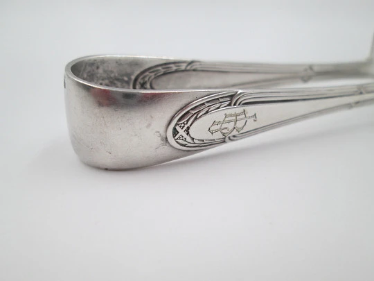 Openwork sugar tongs. Silver plated metal. Ribbed design and wheat ears. 1950's