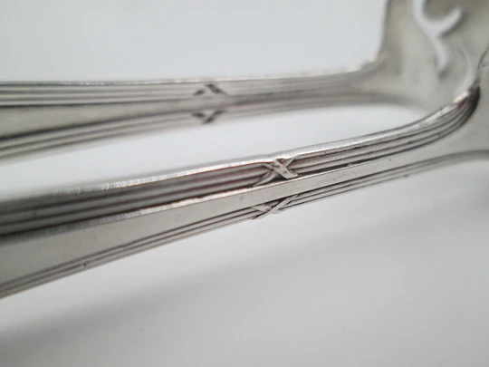 Openwork sugar tongs. Silver plated metal. Ribbed design and wheat ears. 1950's