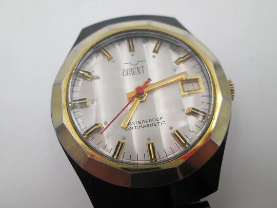 Orient watch. Black blued metal & steel. Golden bezel. Manual wind. Bracelet. 1980's