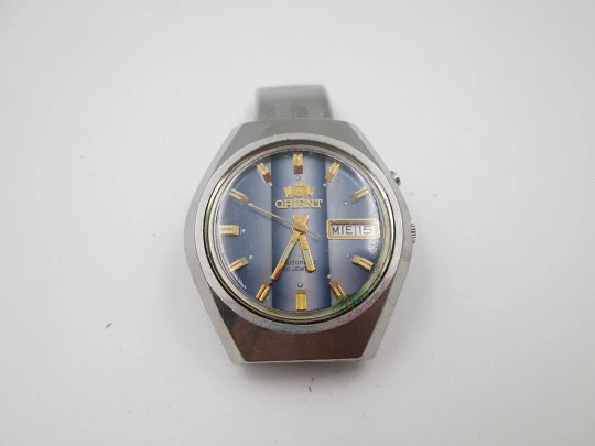 Orient. Acero inoxidable. Dial tornasolado azul. Calendario. Automático. Brazalete. 1970