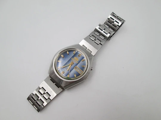 Orient. Acero inoxidable. Dial tornasolado azul. Calendario. Automático. Brazalete. 1970