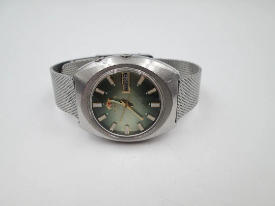 Orient. Acero inoxidable. Dial verde. Cristal facetado. Calendario. Automático. Brazalete