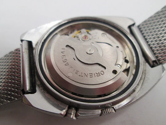 Orient. Acero inoxidable. Dial verde. Cristal facetado. Calendario. Automático. Brazalete