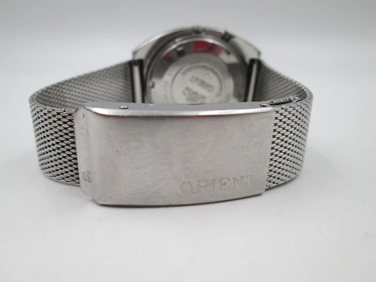 Orient. Stainless steel. Automatic. Calendar. Green dial. Faceted crystal. Bracelet. 1970's