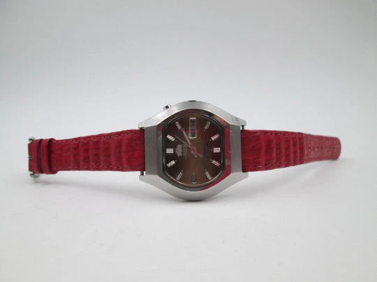 Orient. Stainless steel. Automatic. Date & day. Iridescent dial. Square case. 1970's. Japan