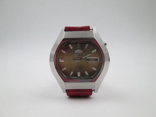 Orient. Stainless steel. Automatic. Date & day. Iridescent dial. Square case. 1970's. Japan