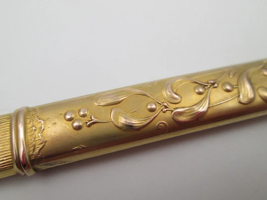 Oril pencil holder with pencil. Gold plated. Floral and vegetable motifs. Europe. 1910's