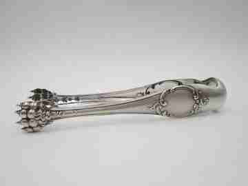 Ornate ice tongs. Sterling silver. Vegetable motifs, shield and claws. Spain. 1970's