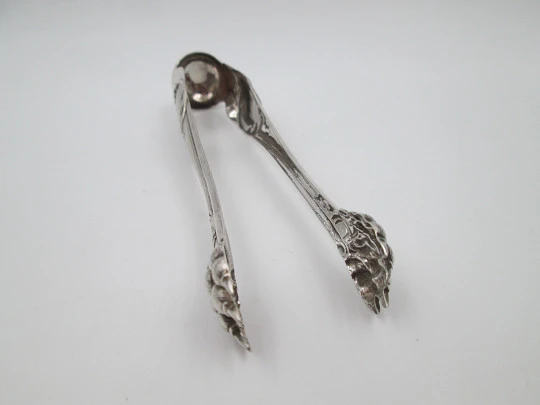 Ornate ice tongs. Sterling silver. Vegetable motifs, shield and claws. Spain. 1970's