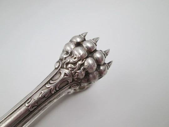 Ornate ice tongs. Sterling silver. Vegetable motifs, shield and claws. Spain. 1970's