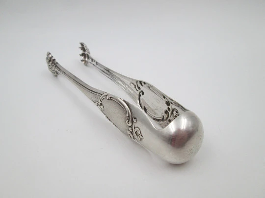 Ornate ice tongs. Sterling silver. Vegetable motifs, shield and claws. Spain. 1970's
