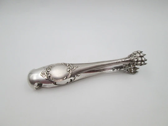 Ornate ice tongs. Sterling silver. Vegetable motifs, shield and claws. Spain. 1970's