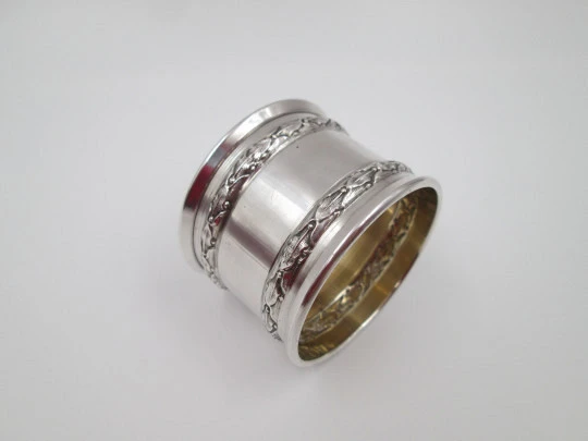 Ornate napkin ring. Sterling silver. Vermeil on inside. Plants motifs. 1970's. France