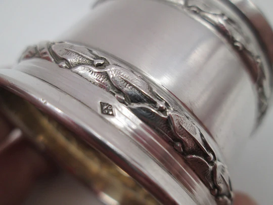 Ornate napkin ring. Sterling silver. Vermeil on inside. Plants motifs. 1970's. France
