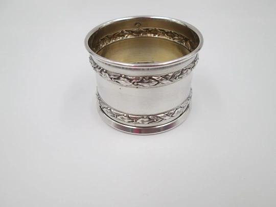 Ornate napkin ring. Sterling silver. Vermeil on inside. Plants motifs. 1970's. France