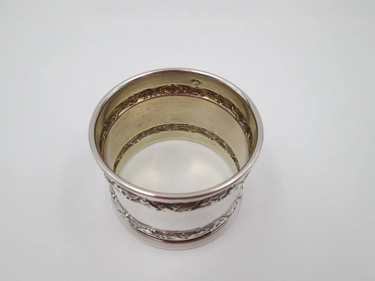Ornate napkin ring. Sterling silver. Vermeil on inside. Plants motifs. 1970's. France