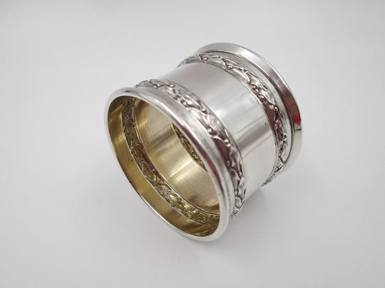 Ornate napkin ring. Sterling silver. Vermeil on inside. Plants motifs. 1970's. France