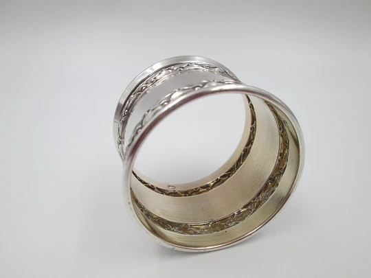 Ornate napkin ring. Sterling silver. Vermeil on inside. Plants motifs. 1970's. France
