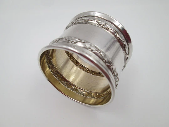 Ornate napkin ring. Sterling silver. Vermeil on inside. Plants motifs. 1970's. France
