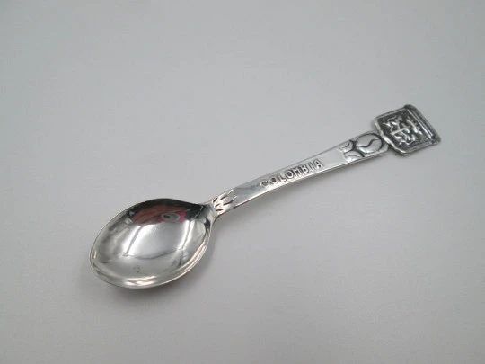 Ornate spoon. Sterling silver. Cartagena shield and coffee bean. Colombia. 1980's