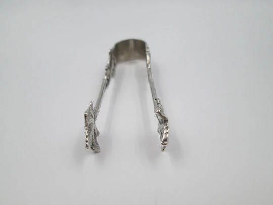 Ornate sugar tongs. Sterling silver. Floral & vegetable motifs. Germany. 1970's