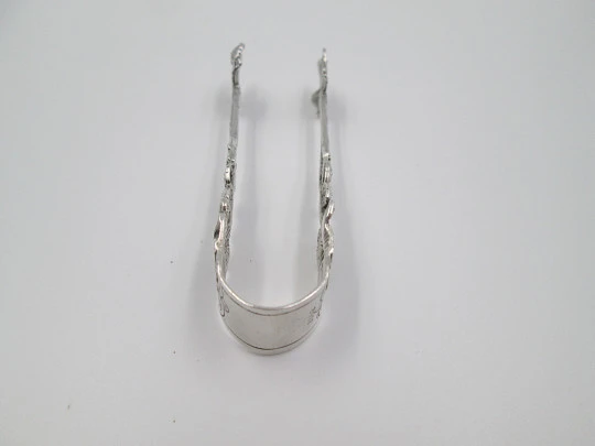 Ornate sugar tongs. Sterling silver. Floral & vegetable motifs. Germany. 1970's