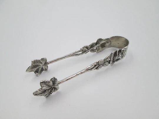 Ornate sugar tongs. Sterling silver. Floral & vegetable motifs. Germany. 1970's