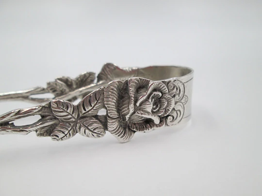 Ornate sugar tongs. Sterling silver. Floral & vegetable motifs. Germany. 1970's