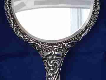 Ornate woman's hand mirror. 1970's. Embossed sterling silver. Spain