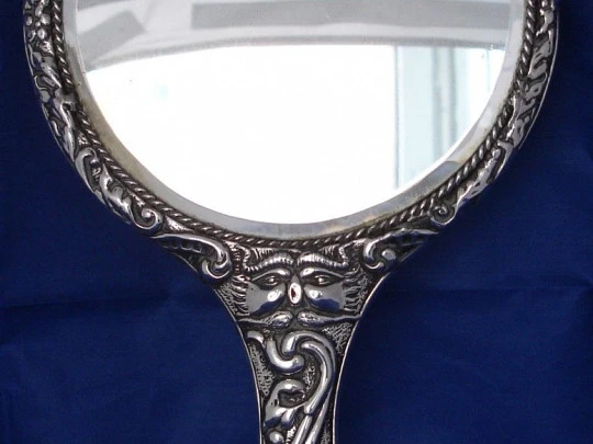 Ornate woman's hand mirror. 1970's. Embossed sterling silver. Spain