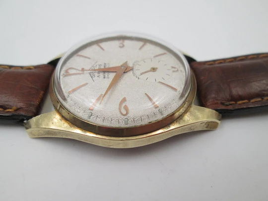 Orval. Gold plated and stainless steel. Textured dial. Small seconds hand. Manual wind. 1960's