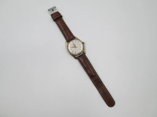 Orval. Gold plated and stainless steel. Textured dial. Small seconds hand. Manual wind. 1960's