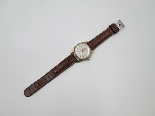 Orval. Gold plated and stainless steel. Textured dial. Small seconds hand. Manual wind. 1960's