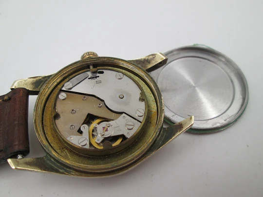 Orval. Gold plated and stainless steel. Textured dial. Small seconds hand. Manual wind. 1960's
