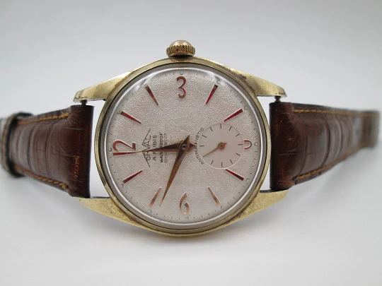 Orval. Gold plated and stainless steel. Textured dial. Small seconds hand. Manual wind. 1960's