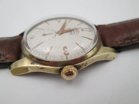 Orval. Gold plated and stainless steel. Textured dial. Small seconds hand. Manual wind. 1960's