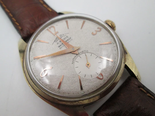 Orval. Gold plated and stainless steel. Textured dial. Small seconds hand. Manual wind. 1960's