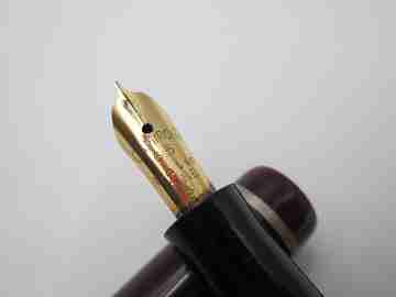 Osmiroid 65 fountain pen. Garnet and black plastic. Silver plated details. Lever filler. 1950