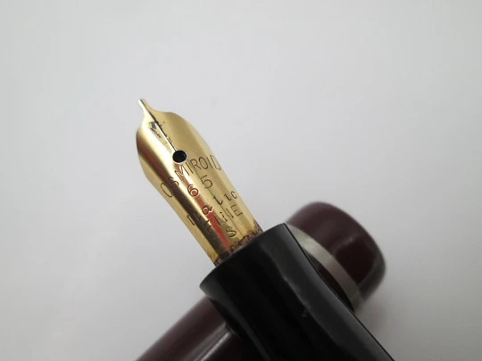 Osmiroid 65 fountain pen. Garnet and black plastic. Silver plated details. Lever filler. 1950