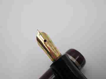 Osmiroid 65 fountain pen. Garnet and black plastic. Silver plated details. Lever filler. 1950