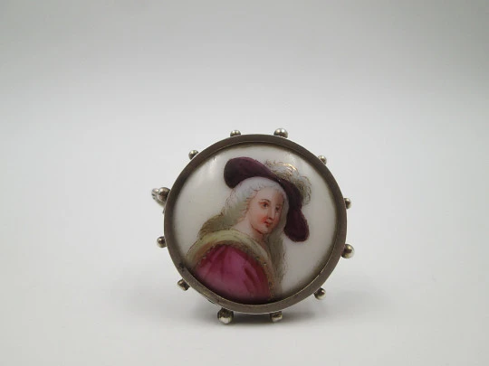 Painted porcelain and sterling silver brooch. Eighteenth century woman. Balls edge. 1940's