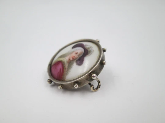 Painted porcelain and sterling silver brooch. Eighteenth century woman. Balls edge. 1940's