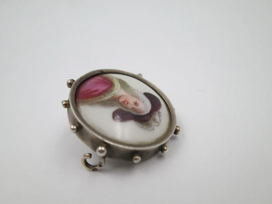 Painted porcelain and sterling silver brooch. Eighteenth century woman. Balls edge. 1940's