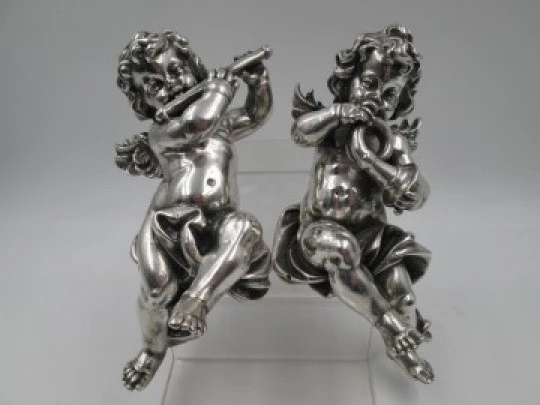 Pair of sculptures. Sterling silver laminated. Cherubs musicians. 1970's