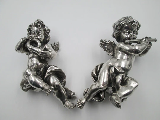 Pair of sculptures. Sterling silver laminated. Cherubs musicians. 1970's